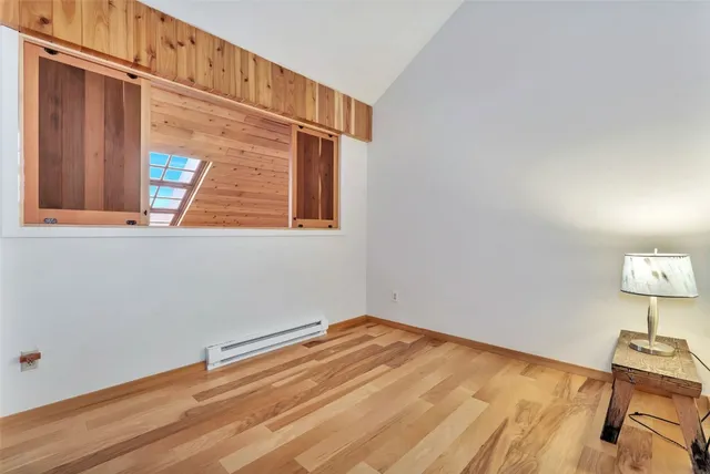a view of staircase with railing and white walls