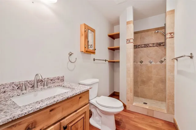 a bathroom with a sink toilet and shower