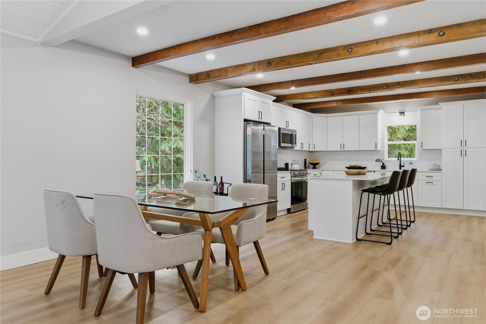 25816 178th Street Southeast Monroe, WA 98272 - Photo 13 of 40 a view of a dining room with furniture and a kitchen