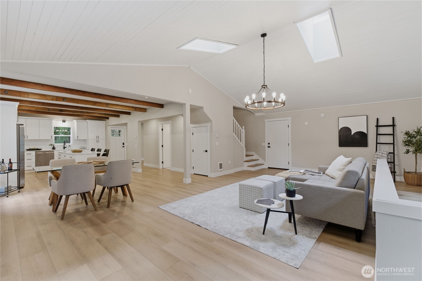 25816 178th Street Southeast Monroe, WA 98272 - Photo 15 of 40 a living room with furniture a chandelier and a dining table