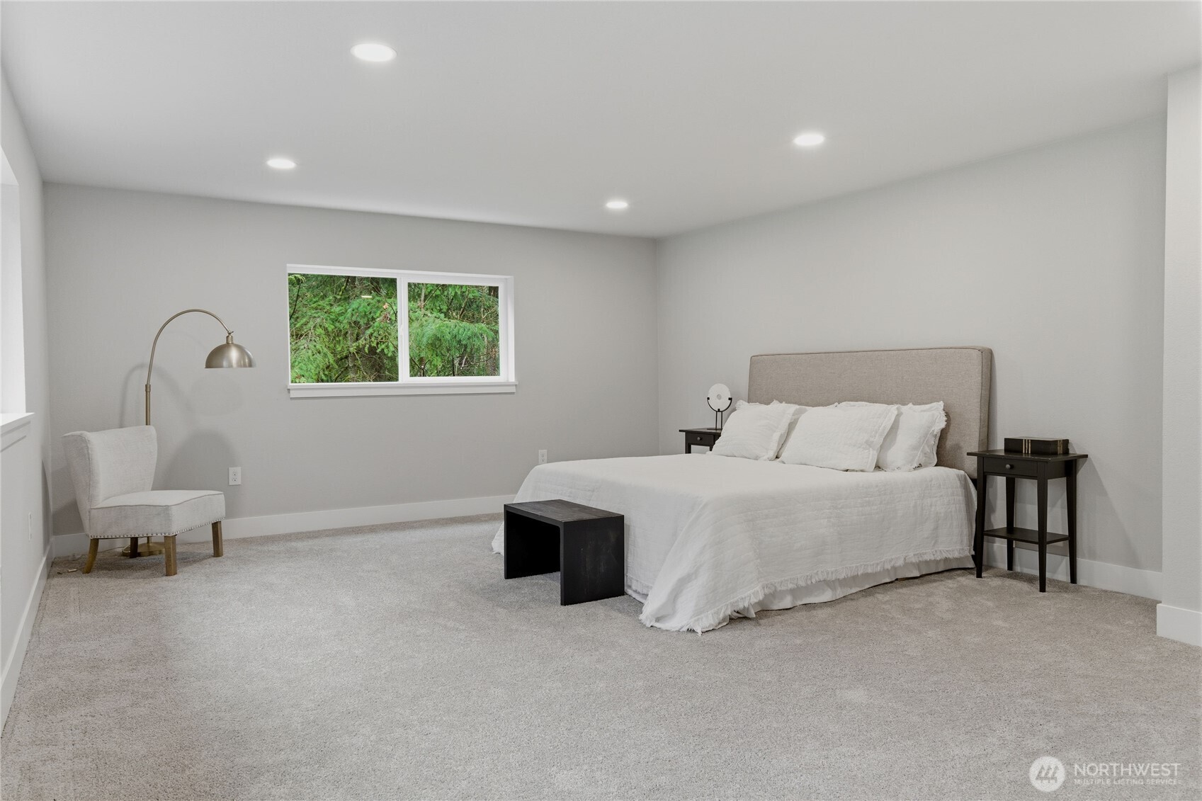 25816 178th Street Southeast Monroe, WA 98272 - Photo 20 of 40 a spacious bedroom with a bed and a couch