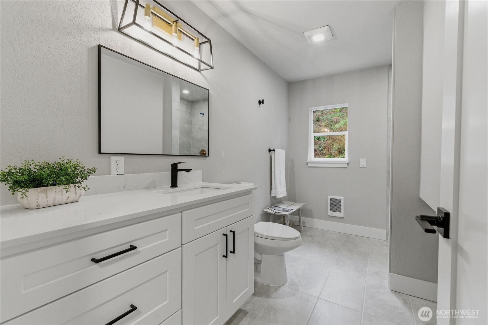 25816 178th Street Southeast Monroe, WA 98272 - Photo 23 of 40 a bathroom with a toilet sink and mirror