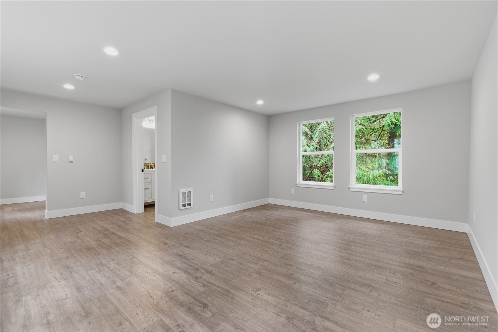 25816 178th Street Southeast Monroe, WA 98272 - Photo 29 of 40 an empty room with wooden floor and windows