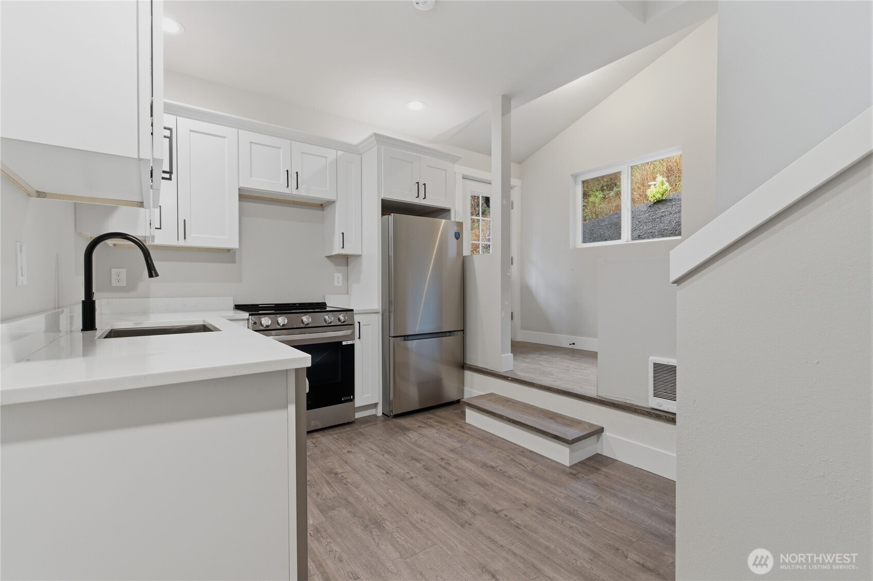 25816 178th Street Southeast Monroe, WA 98272 - Photo 34 of 40 a kitchen with a refrigerator sink and cabinets