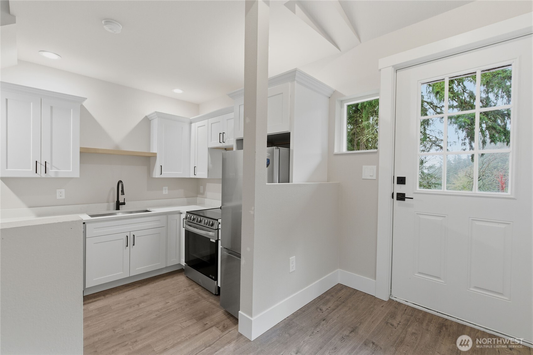25816 178th Street Southeast Monroe, WA 98272 - Photo 35 of 40 a kitchen with a sink stove and refrigerator