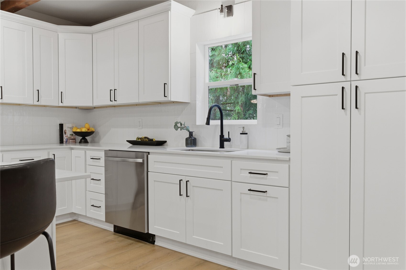 25816 178th Street Southeast Monroe, WA 98272 - Photo 7 of 40 a kitchen with white cabinets and white appliances