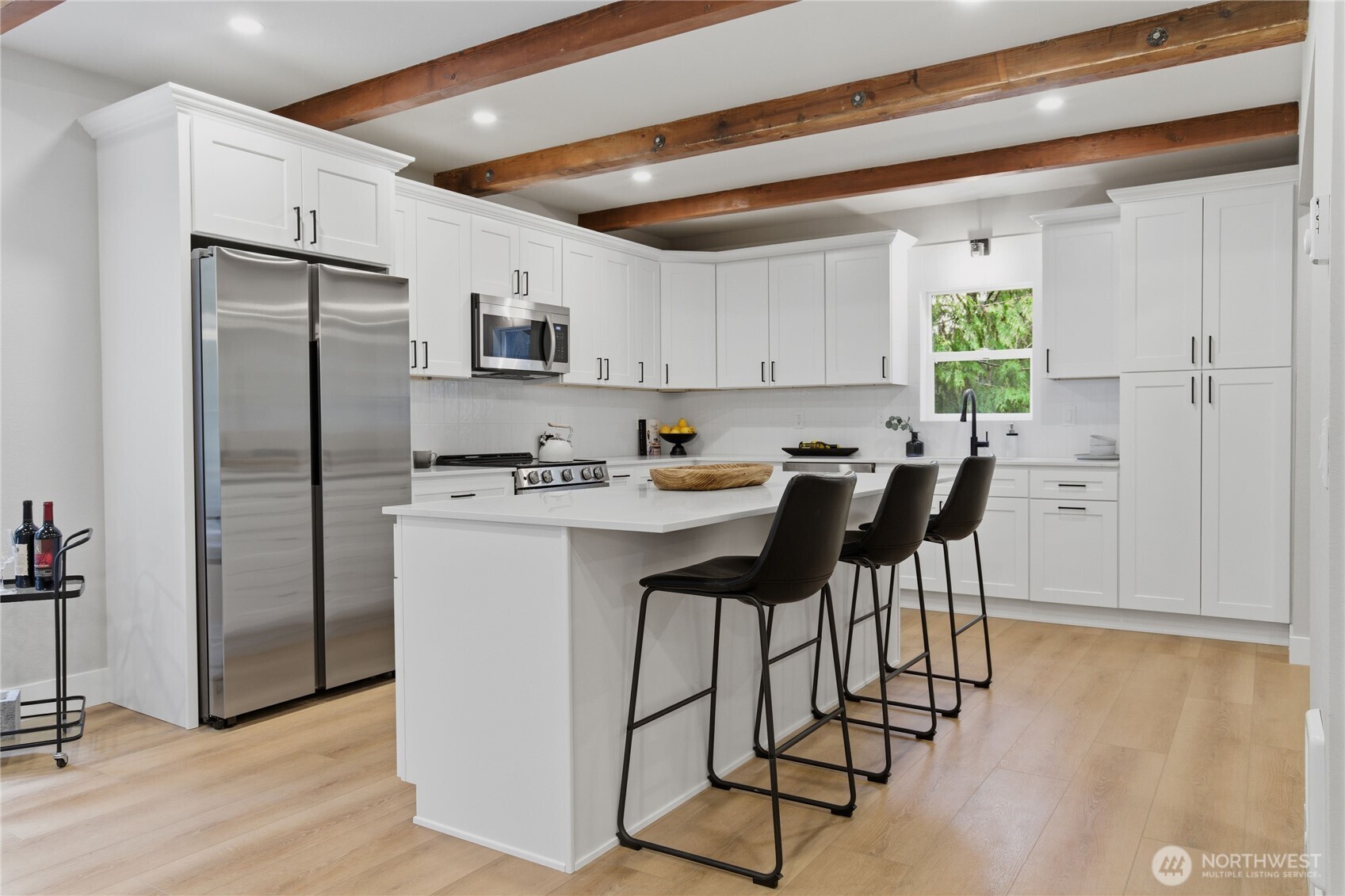 25816 178th Street Southeast Monroe, WA 98272 - Photo 9 of 40 a kitchen with stainless steel appliances granite countertop a refrigerator sink and white cabinets