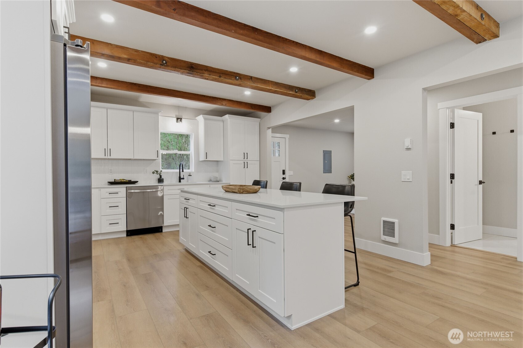 25816 178th Street Southeast Monroe, WA 98272 - Photo 10 of 40 a large kitchen with kitchen island white cabinets and stainless steel appliances