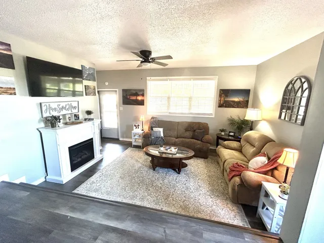 a kitchen with a refrigerator stove microwave and cabinets
