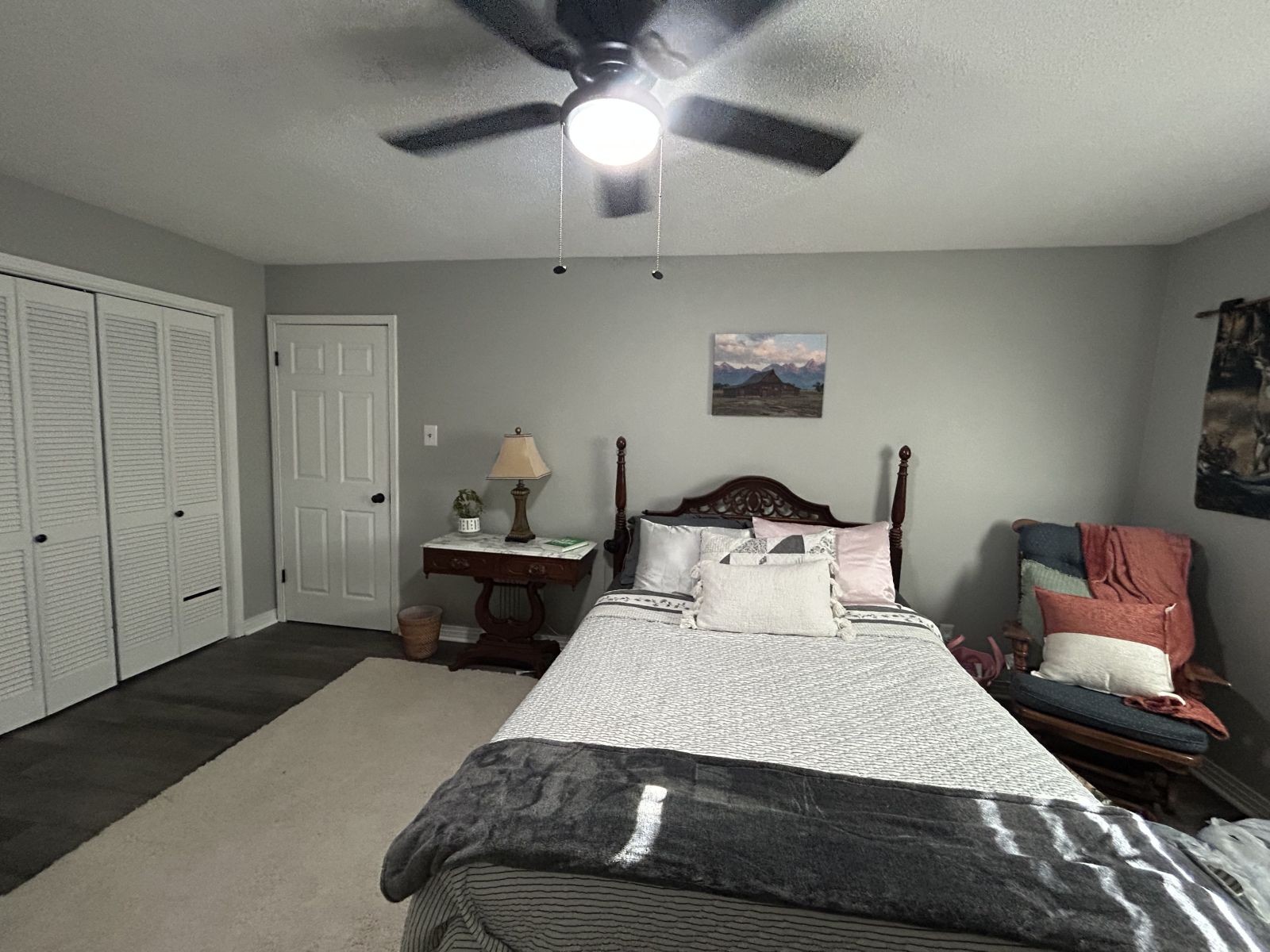 1800 Ozment Road Dyersburg, TN 38024 - Photo 21 of 30 a bedroom with a bed and a chandelier
