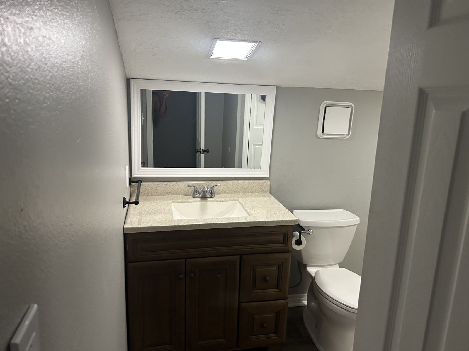 1800 Ozment Road Dyersburg, TN 38024 - Photo 25 of 30 a bathroom with a toilet sink and mirror