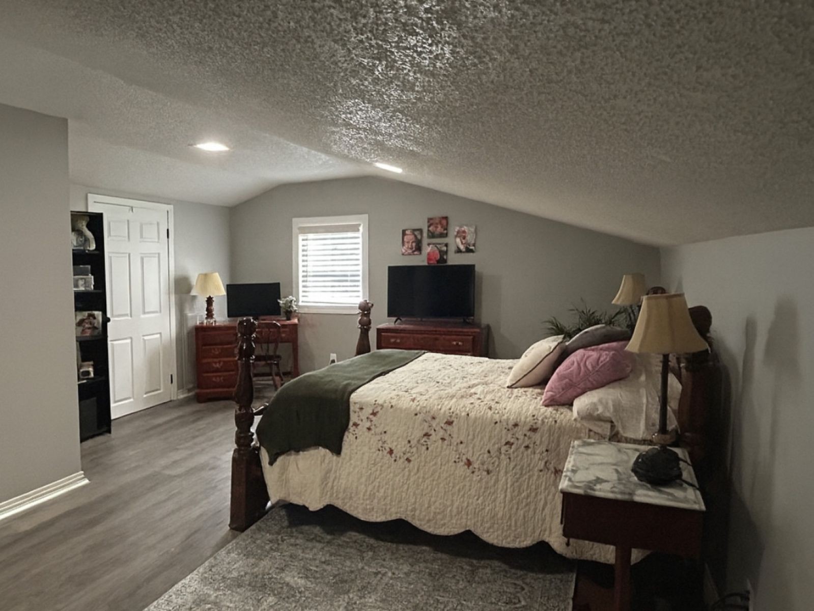 1800 Ozment Road Dyersburg, TN 38024 - Photo 28 of 30 a bedroom with a bed and wooden floor