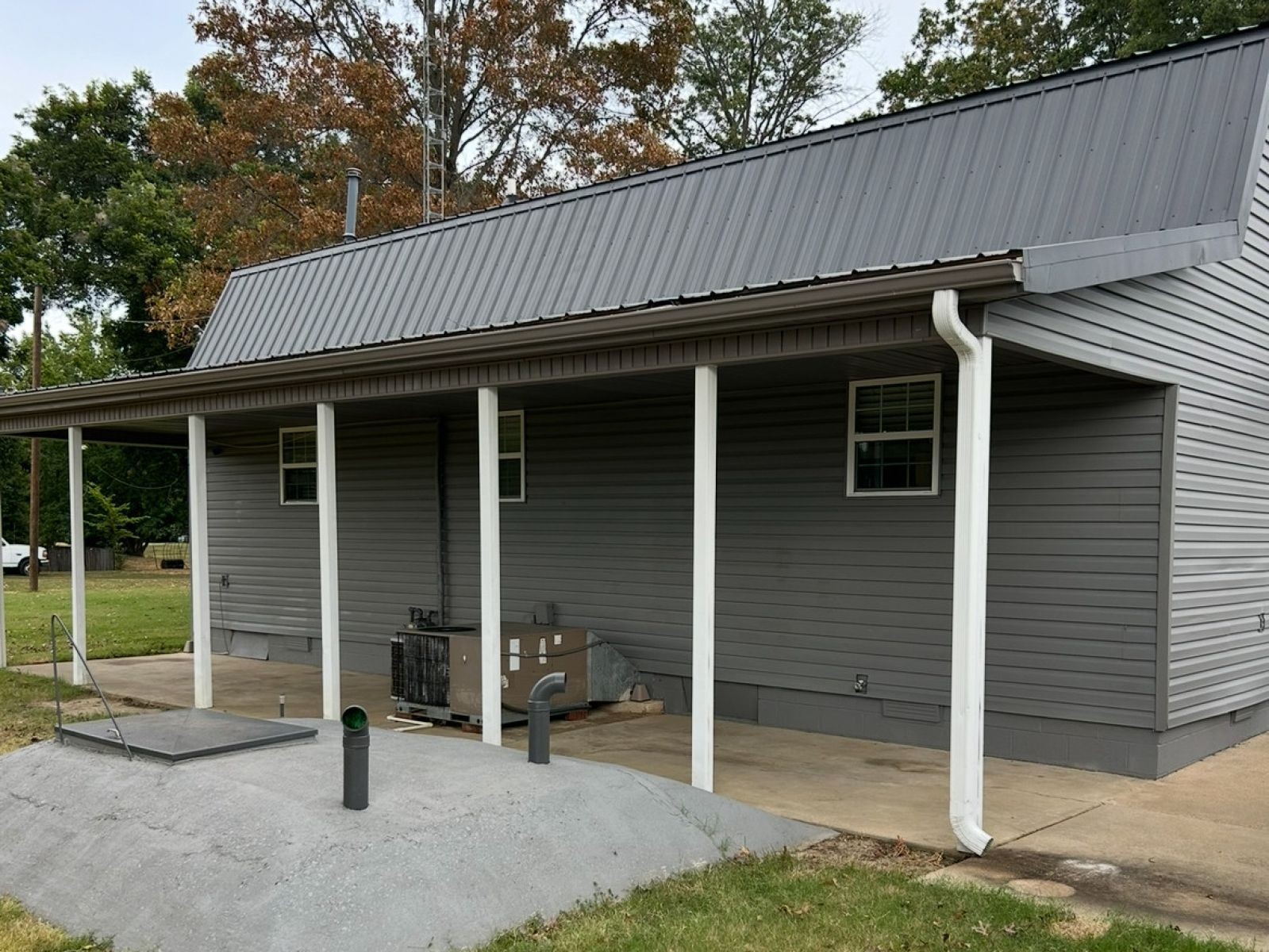 1800 Ozment Road Dyersburg, TN 38024 - Photo 4 of 30 a view of a small house and a yard with wooden fence