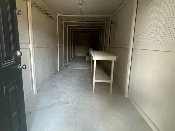 a view of a livingroom with table and chair