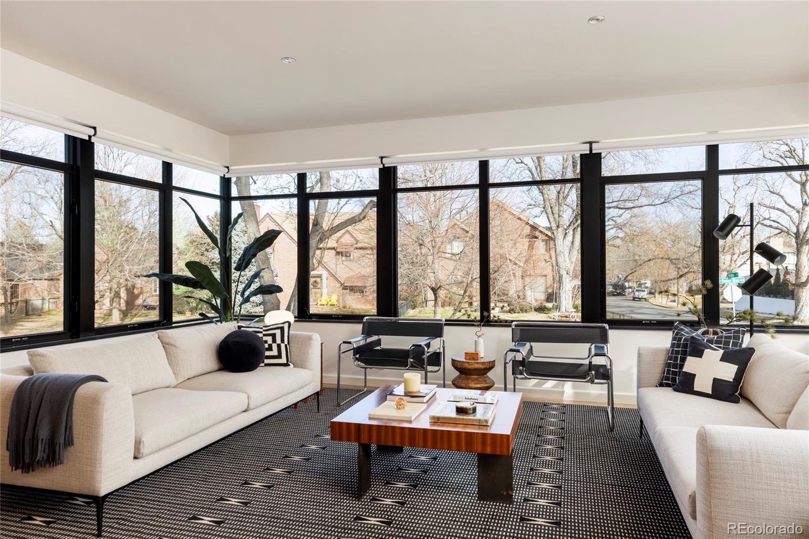 801 South Ellipse Way Denver, CO 80209 - Photo 11 of 50 a living room with furniture and a large window