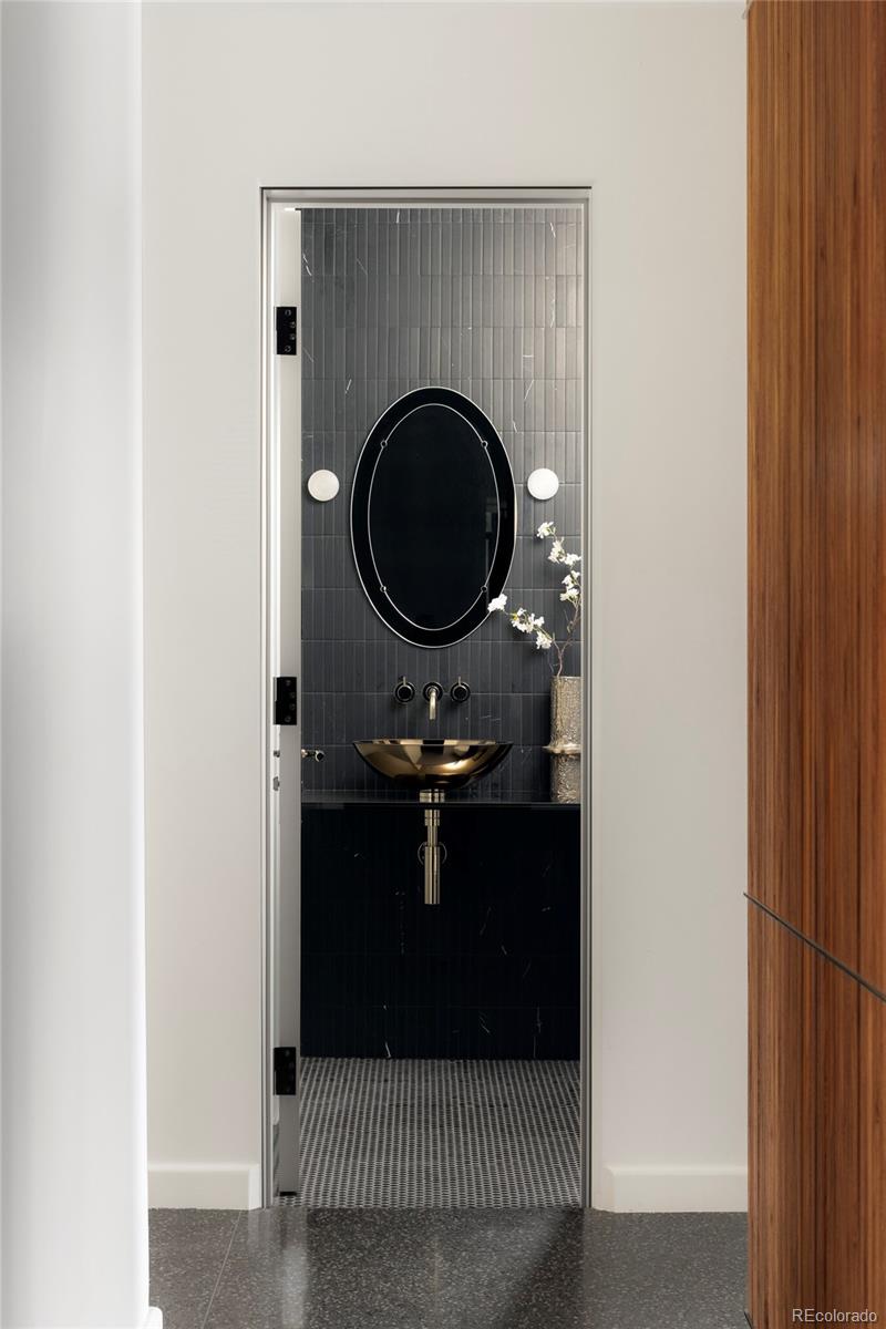 801 South Ellipse Way Denver, CO 80209 - Photo 13 of 50 a bathroom with a sink and a mirror