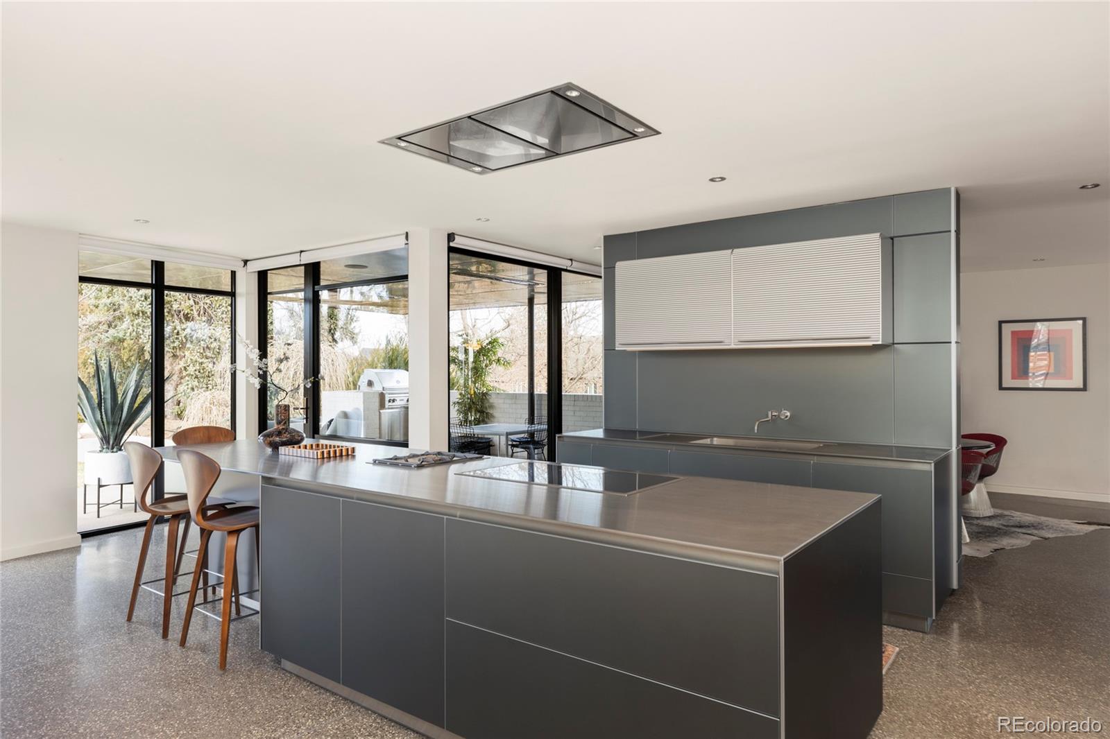 801 South Ellipse Way Denver, CO 80209 - Photo 16 of 50 a room with a view of dining room and chairs