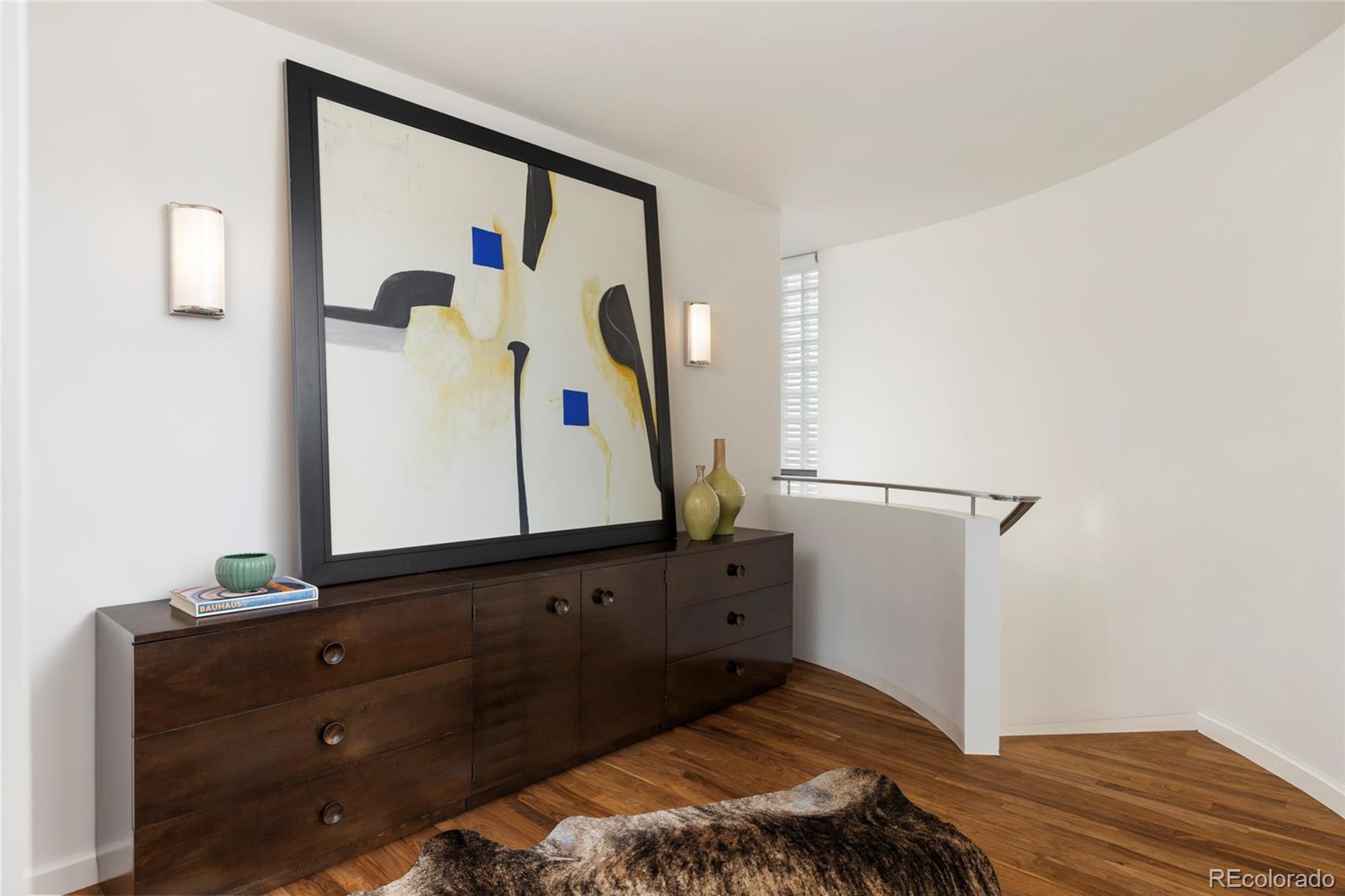 801 South Ellipse Way Denver, CO 80209 - Photo 20 of 50 a bedroom with a bed and a mirror