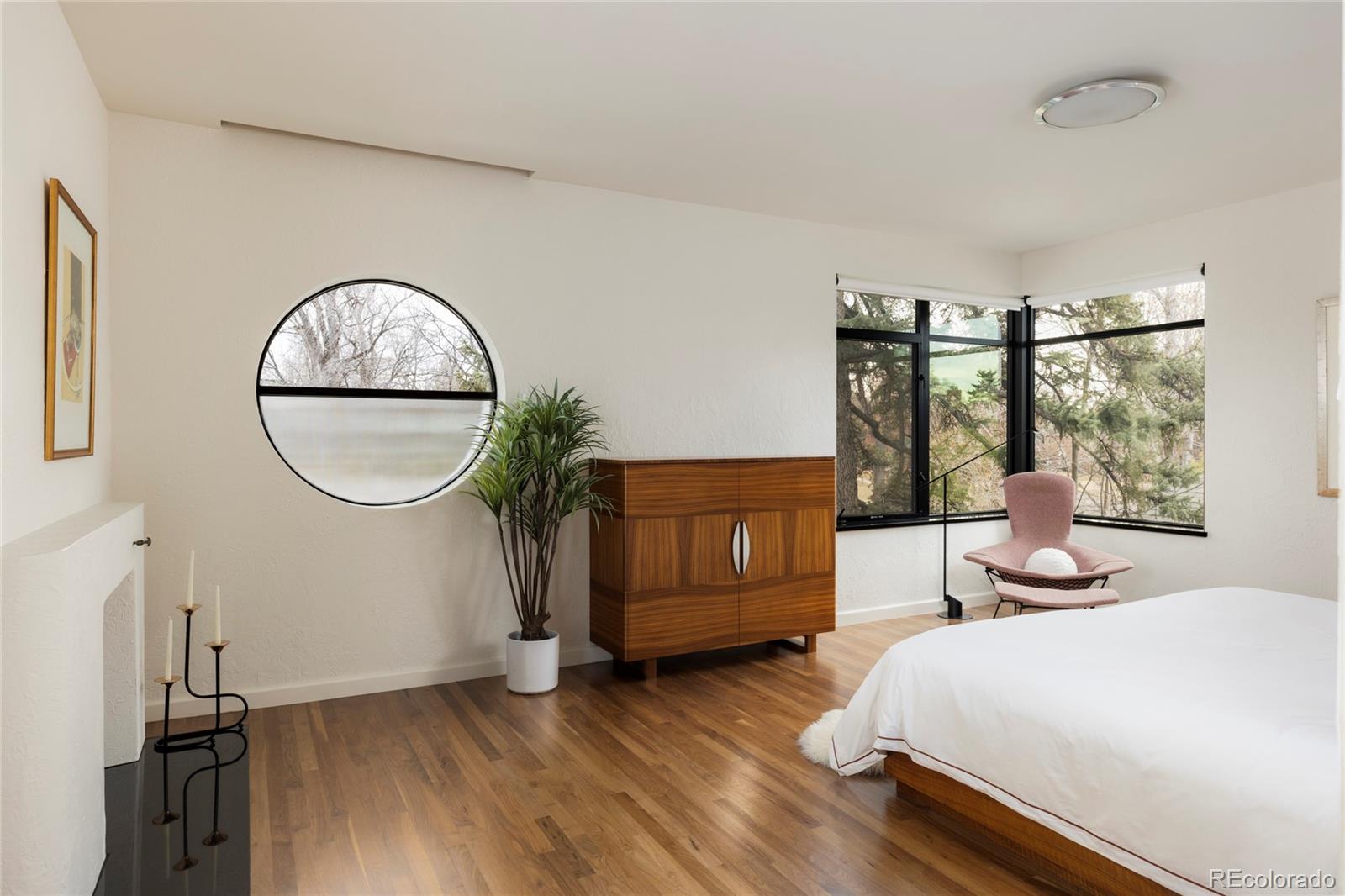 801 South Ellipse Way Denver, CO 80209 - Photo 22 of 50 a bedroom with a bed and a large window