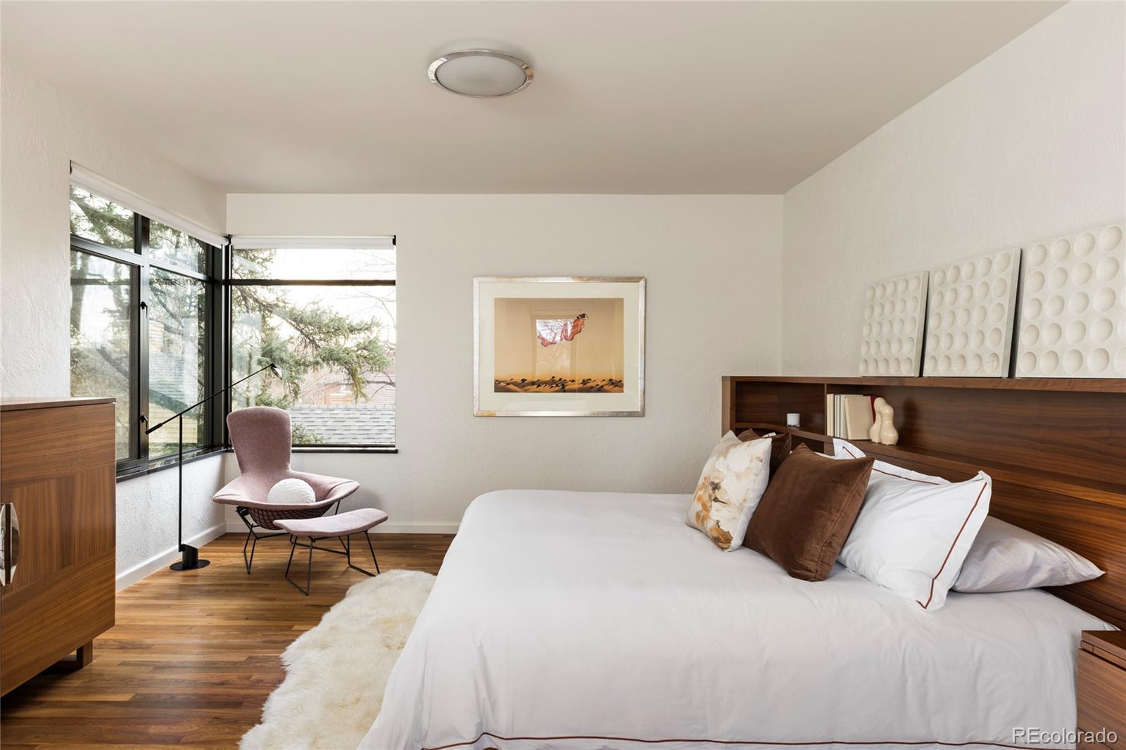 801 South Ellipse Way Denver, CO 80209 - Photo 23 of 50 a bedroom with a large bed and a window