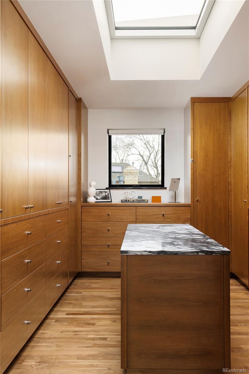 801 South Ellipse Way Denver, CO 80209 - Photo 25 of 50 a bathroom with a sink a mirror and a shower