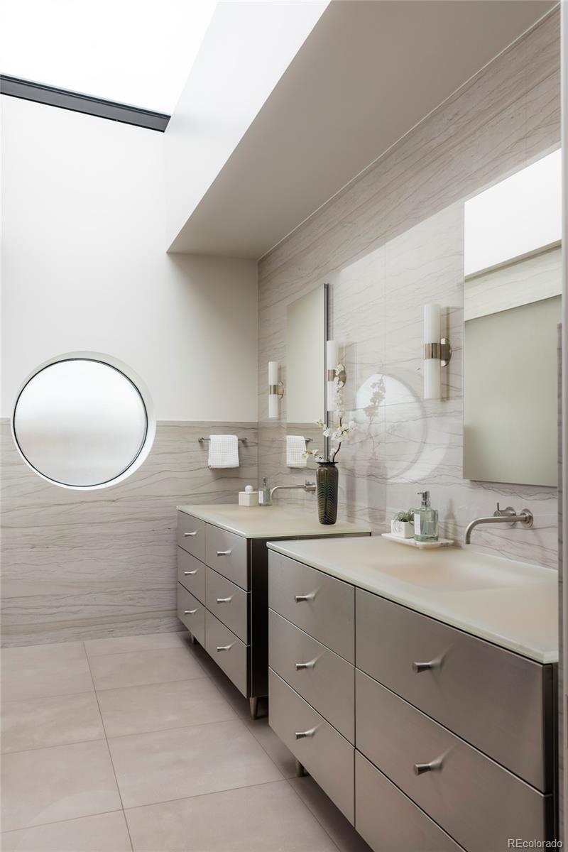 801 South Ellipse Way Denver, CO 80209 - Photo 26 of 50 a bathroom with a double vanity sink and a mirror