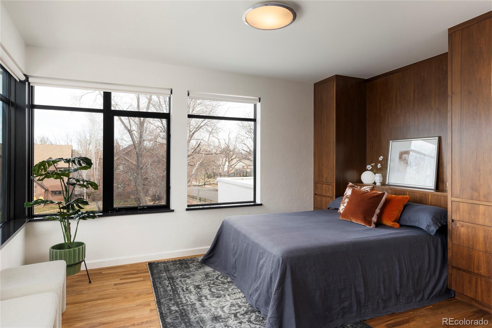 801 South Ellipse Way Denver, CO 80209 - Photo 28 of 50 a bedroom with a large bed and a window