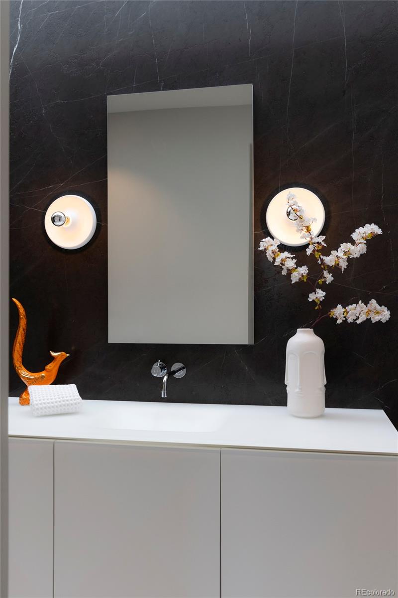 801 South Ellipse Way Denver, CO 80209 - Photo 30 of 50 a bathroom with a sink and a mirror