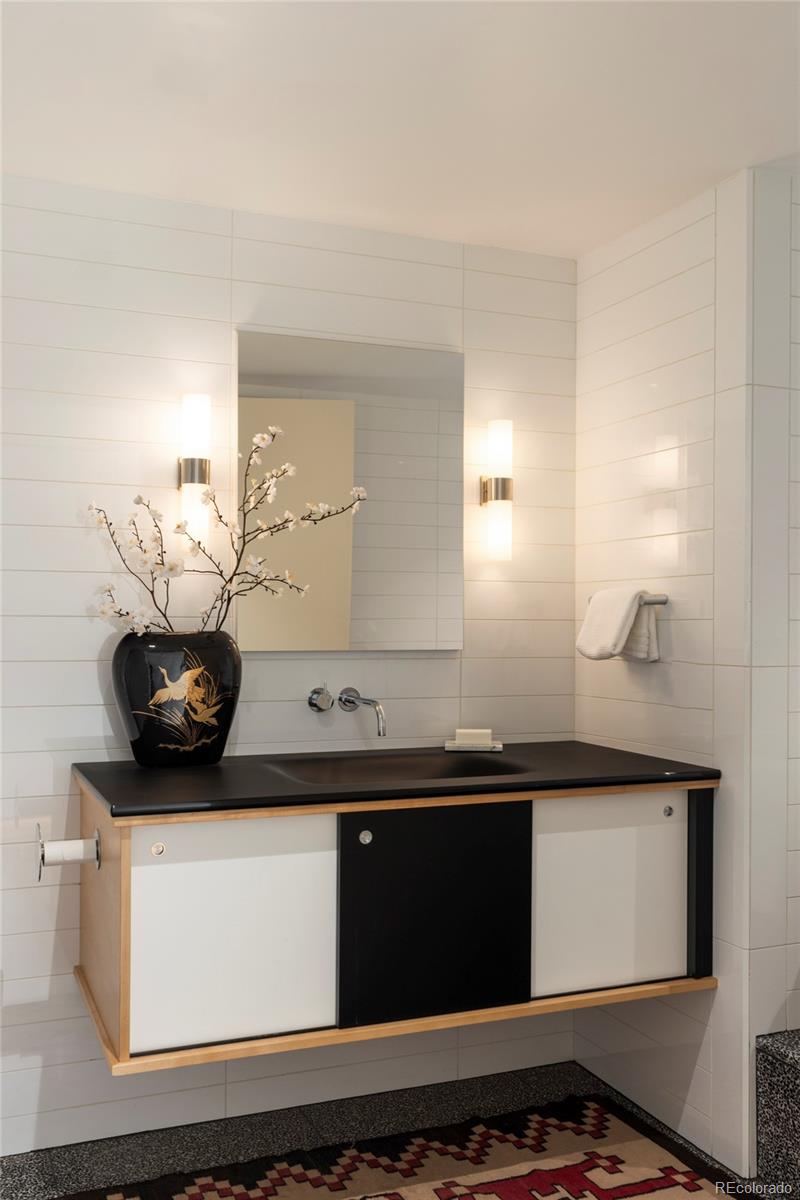 801 South Ellipse Way Denver, CO 80209 - Photo 33 of 50 a bathroom with a sink and a mirror