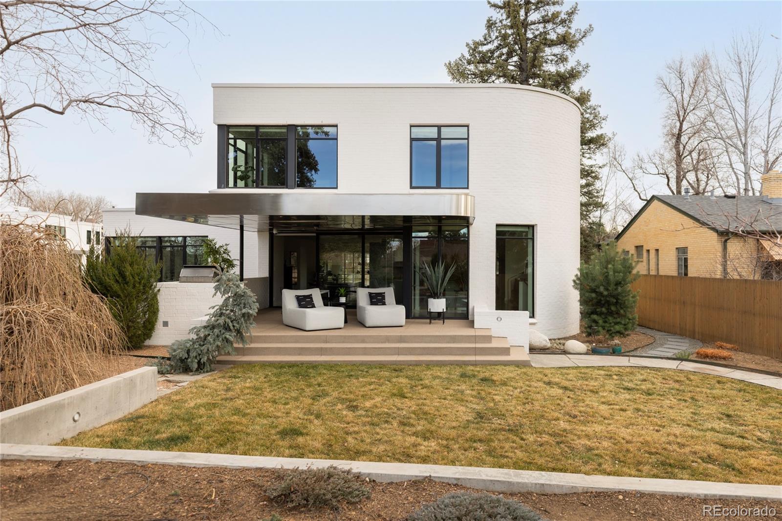 801 South Ellipse Way Denver, CO 80209 - Photo 37 of 50 a view of a house with backyard porch and sitting area