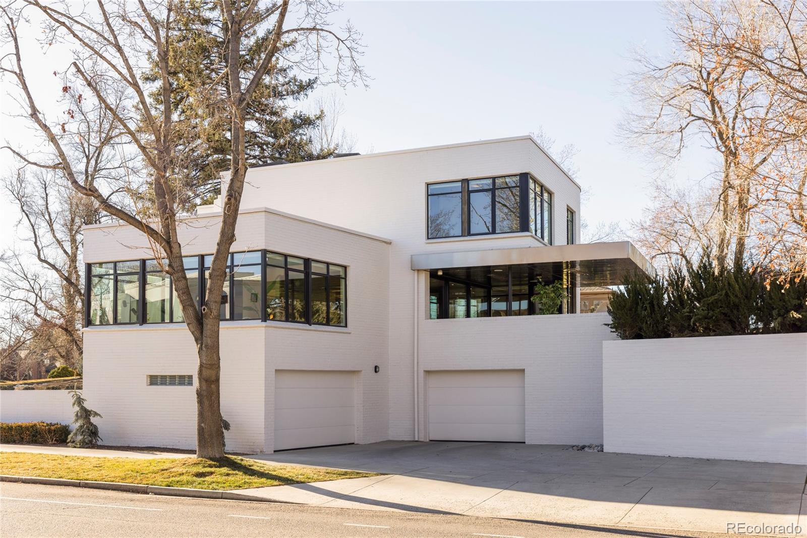 801 South Ellipse Way Denver, CO 80209 - Photo 44 of 50 a front view of a house with a yard