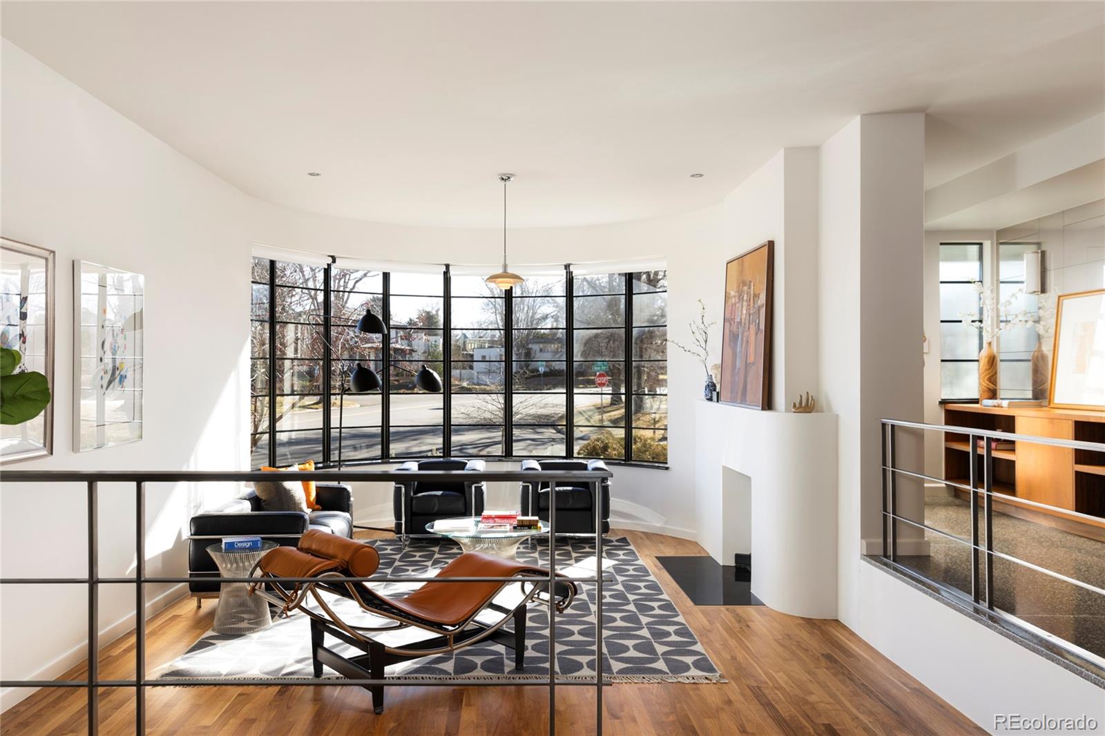 801 South Ellipse Way Denver, CO 80209 - Photo 5 of 50 a living room with furniture and large windows