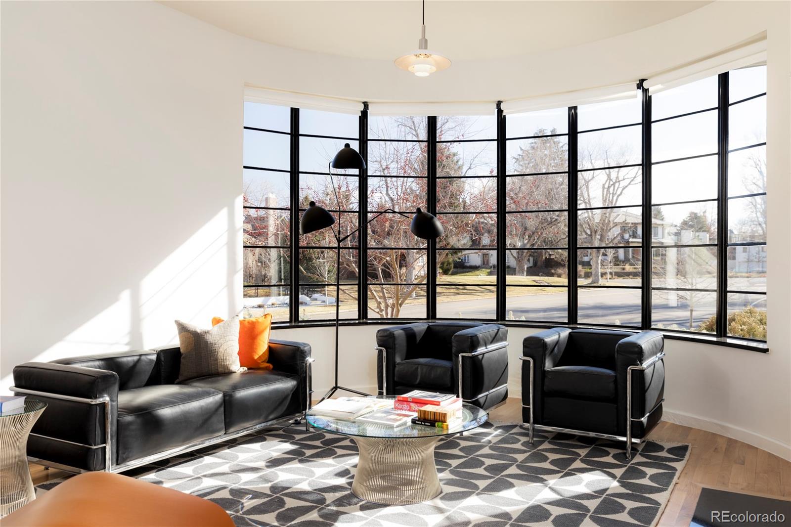 801 South Ellipse Way Denver, CO 80209 - Photo 6 of 50 a living room with furniture and a floor to ceiling window