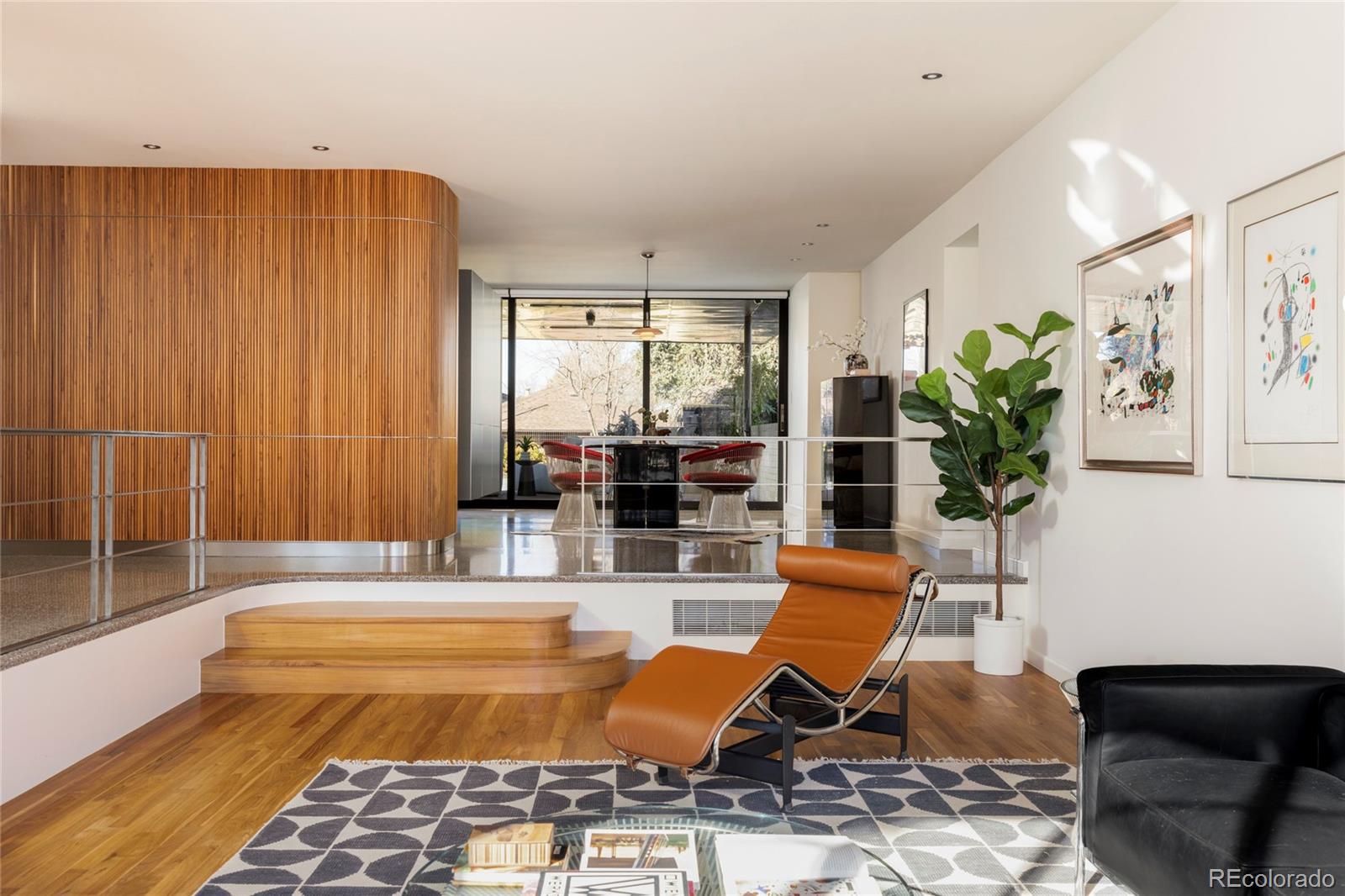 801 South Ellipse Way Denver, CO 80209 - Photo 8 of 50 a living room with patio furniture and a potted plant