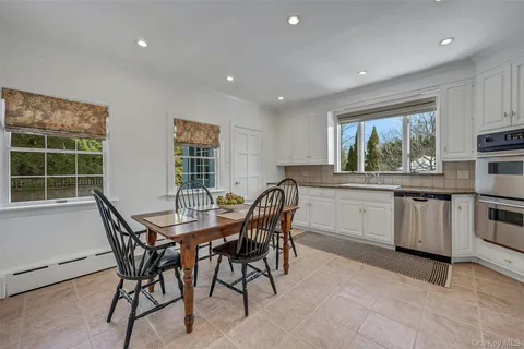 a view of a chairs and table in patio