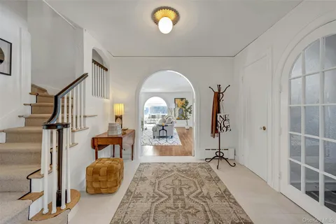 a view of living room with furniture and a window