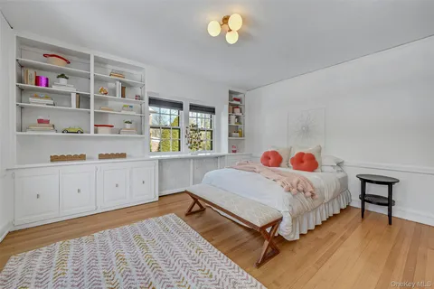 a bedroom with bed and a window