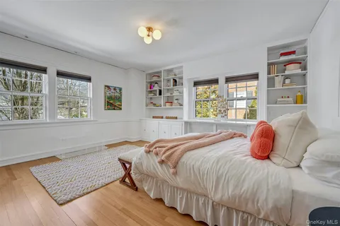 a bathroom with a sink toilet vanity and shower