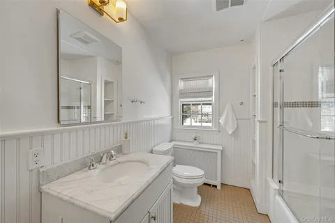 a bedroom with a bed and a desk