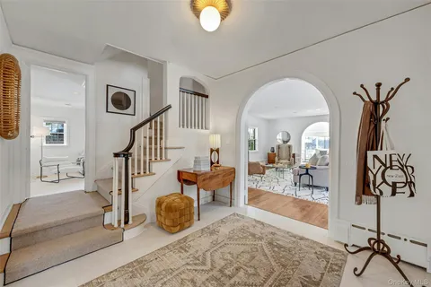 a view of living room filled with furniture and wooden floor