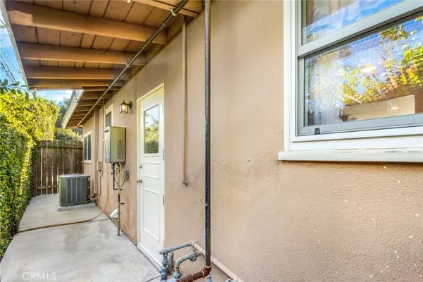 a view of a door and wooden floor