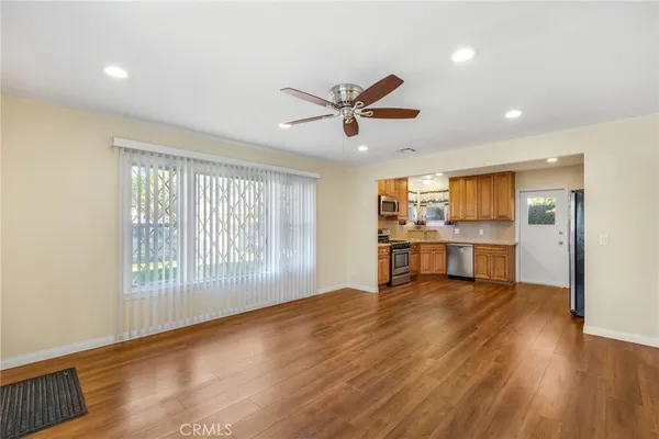a view of a kitchen with a sink and a window