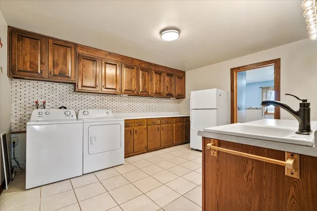 a view of empty room with wooden floor and cabinet