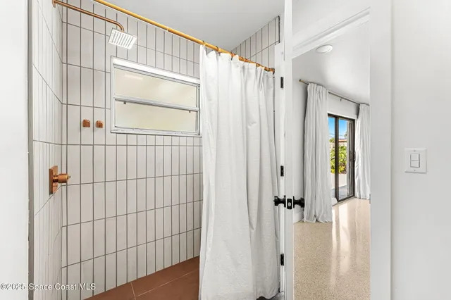 a view of a bathroom with a shower