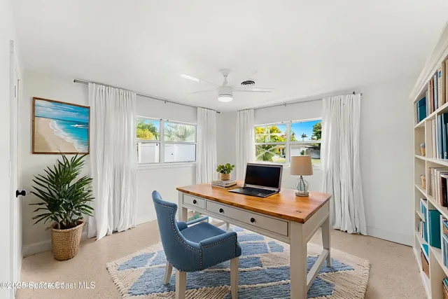 a workspace with furniture and a potted plant