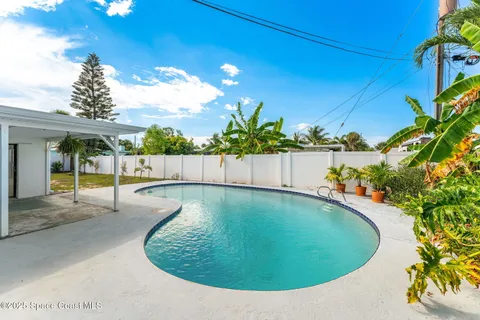 a view of a swimming pool with a yard