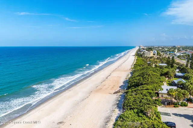 a view of a lake with a yard