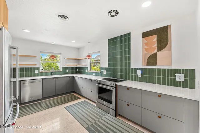 a kitchen with a sink window and cabinets