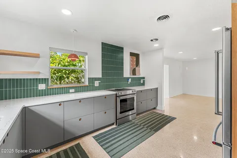 a large kitchen with a large window
