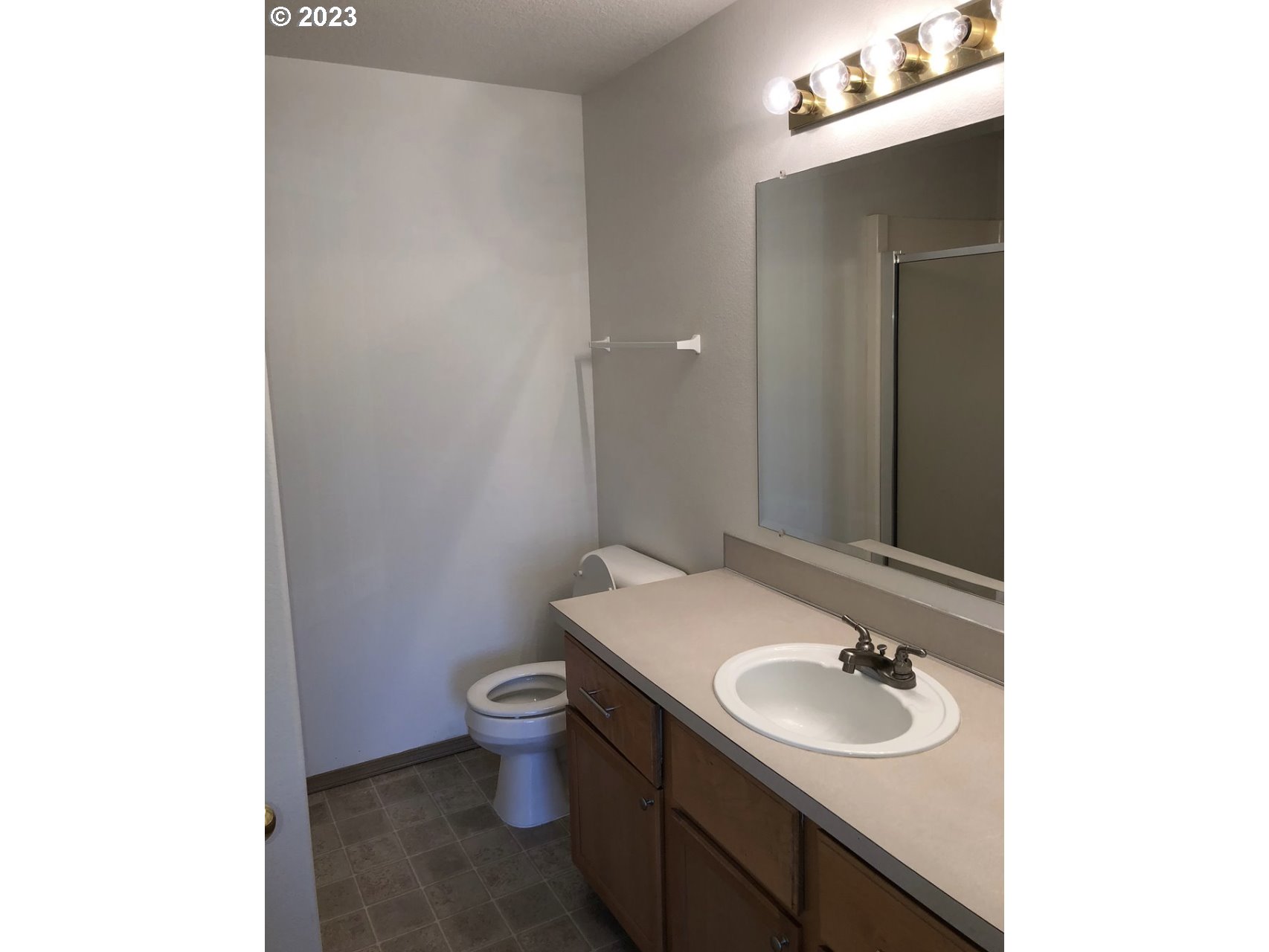 1001 Southwest Nye Avenue Pendleton, OR 97801 - Photo 11 of 14 a bathroom with a sink toilet and mirror